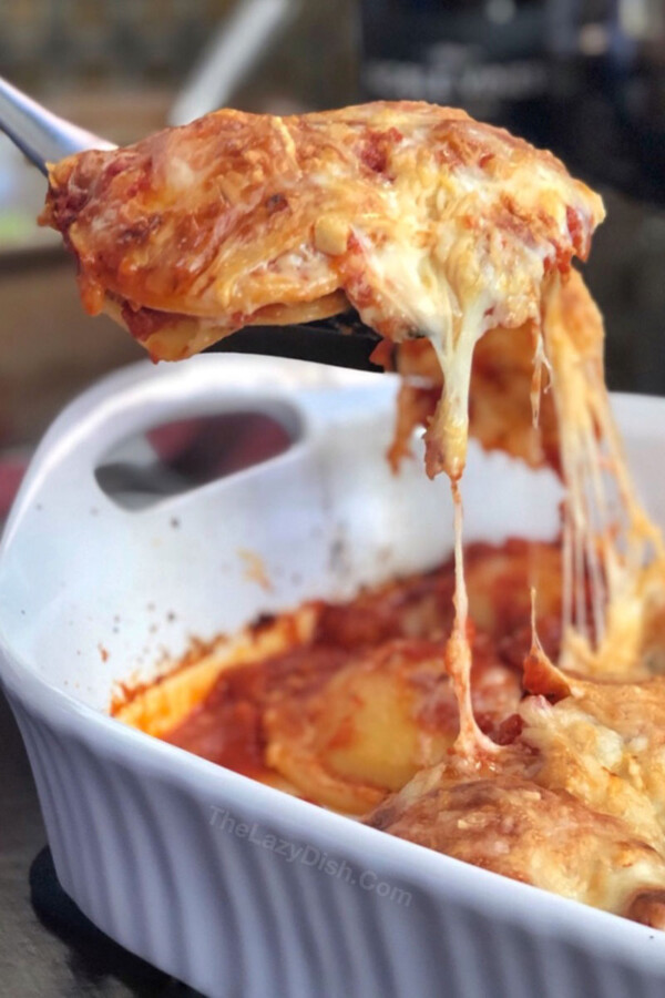 Scooping lasagne from a pan