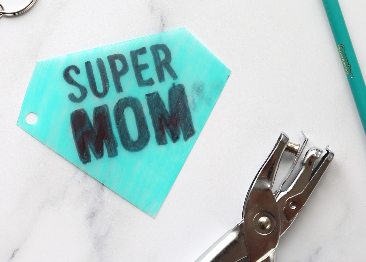Colored super mom shrinky dink keychain with hole punch