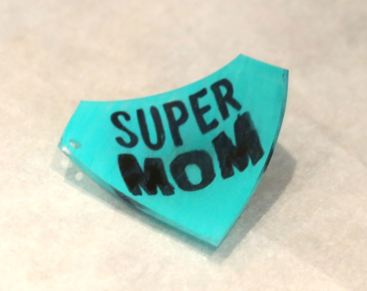 Shrinky dinks curve while baking