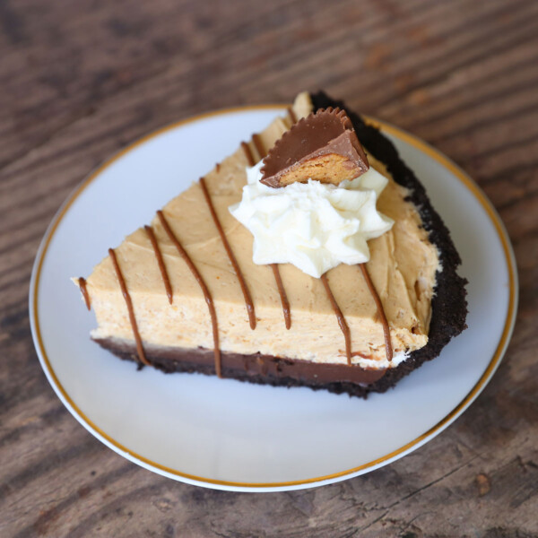 Pie with Oreo crust, chocolate ganache, and peanut butter cream layers