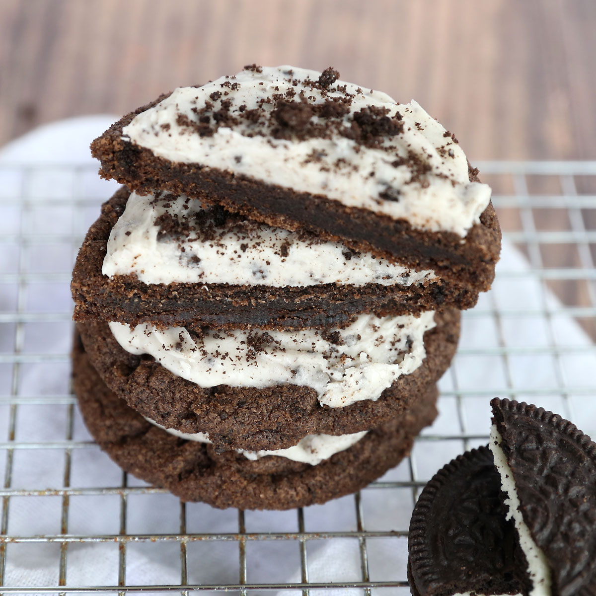 A stack of Oreo sugar cookies with the top one cut in half