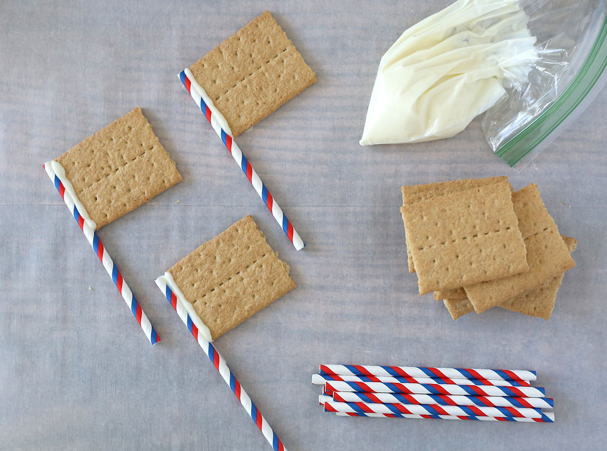 Graham crackers "glued" to straw flagpoles