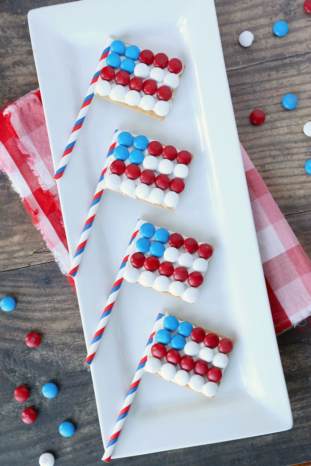 Graham crackers decorated to look like the American flag, with red, white and blue M&Ms on top