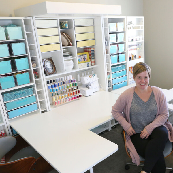 A woman sitting in front of a DreamBox, a craft organization system