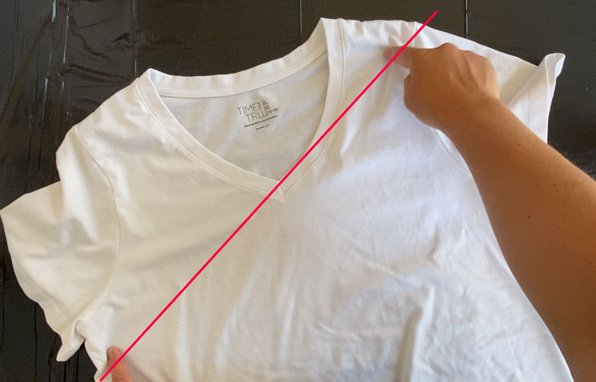 White t-shirt with a diagonal line from under the left arm to the right shoulder