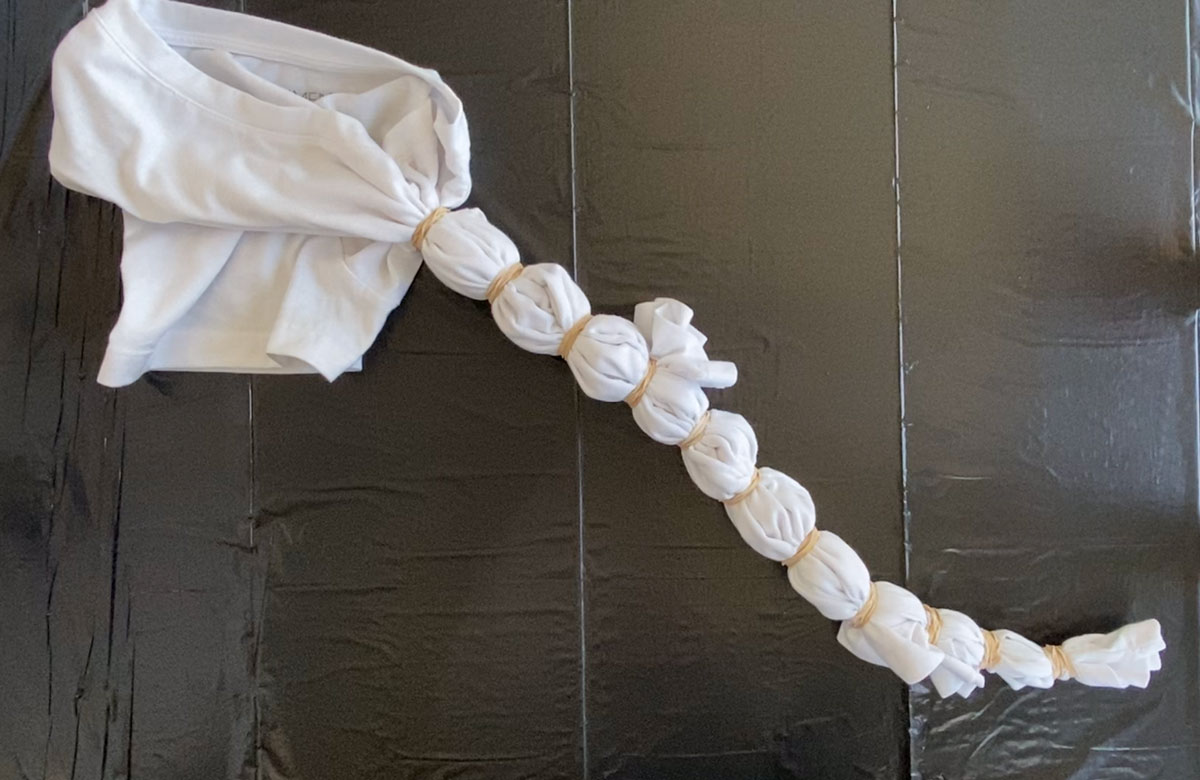 Shirt with rubber bands, prepped for tie dye