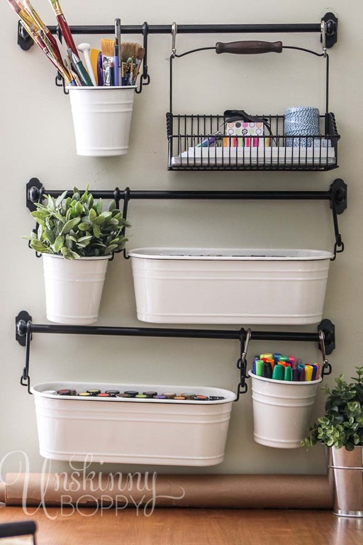 IKEA Fintorp hanging buckets on rails with craft supplies in them