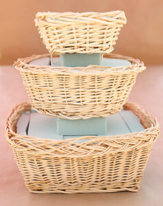 Small basket stacked on top of medium and large baskets