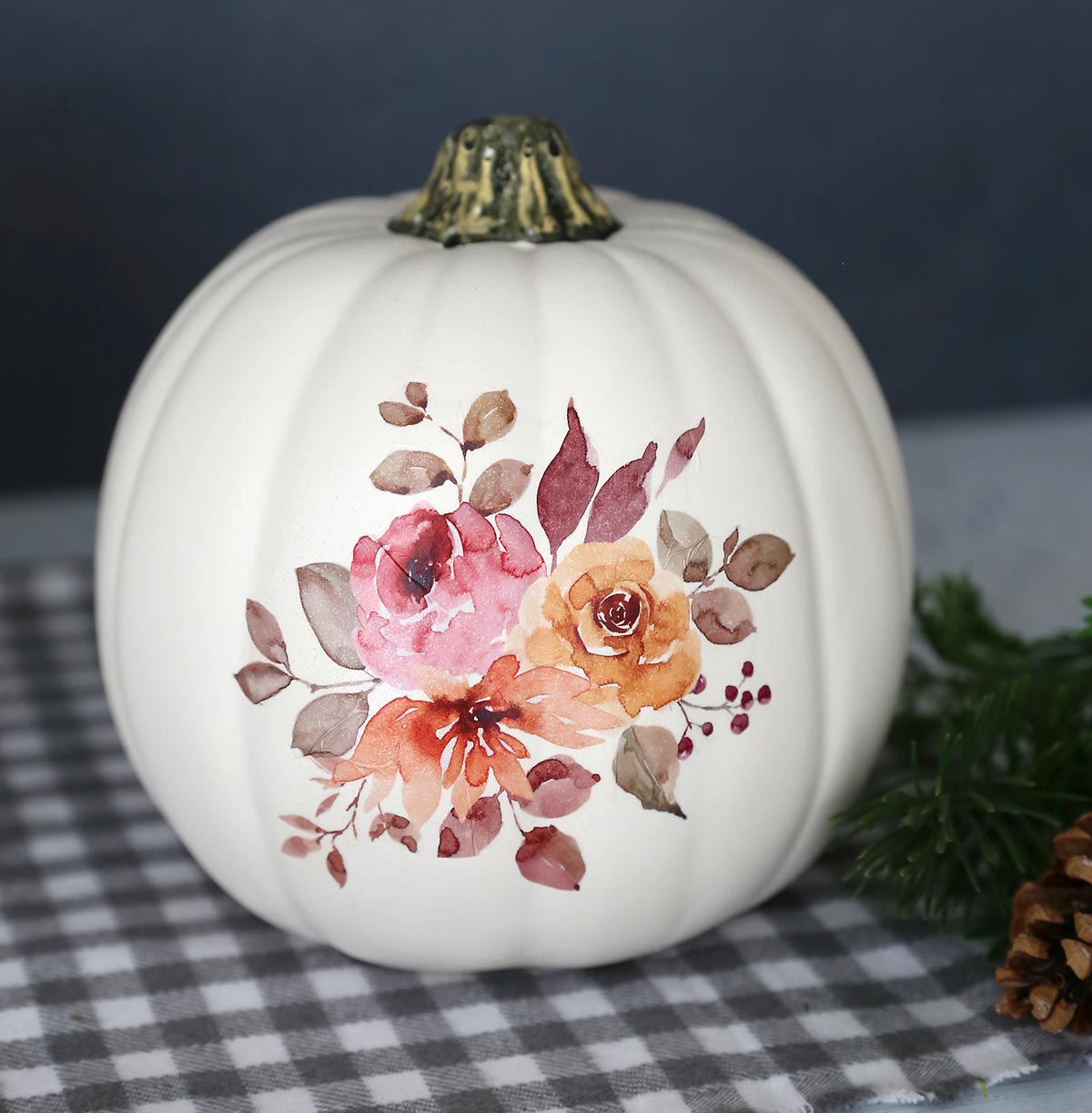 White craft pumpkin with fall floral design transferred onto it