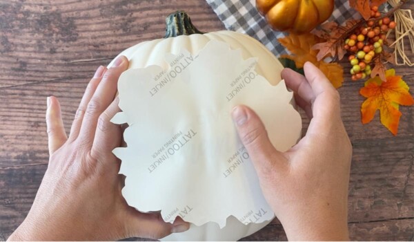Place design side down on the craft pumpkin