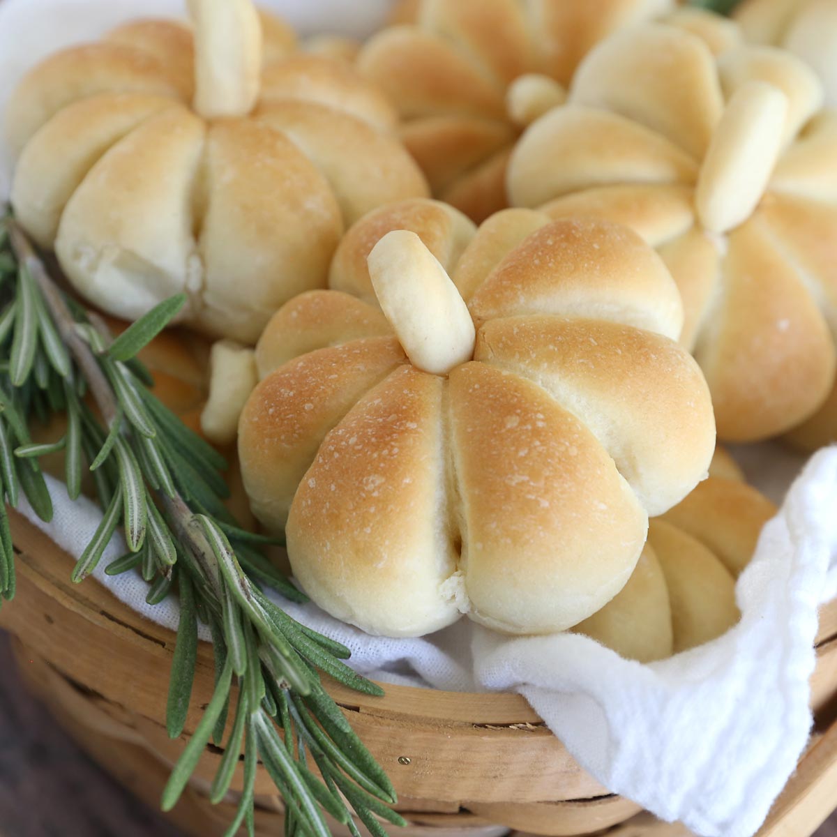 Basket of pumpkin shaped dinner rolls