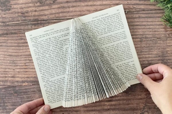 Folded pages create a Christmas tree shape