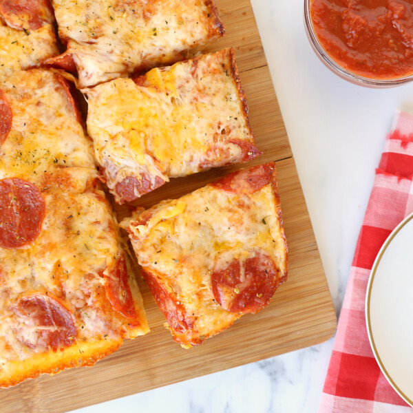 Slices of Detroit style thick crust pan pizza