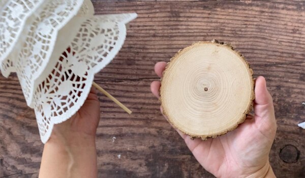 Wood slice with hole drilled in it for the tree base