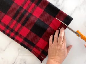 Cut fringe on one end of hat