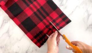 Cut fringe in fleece scarf