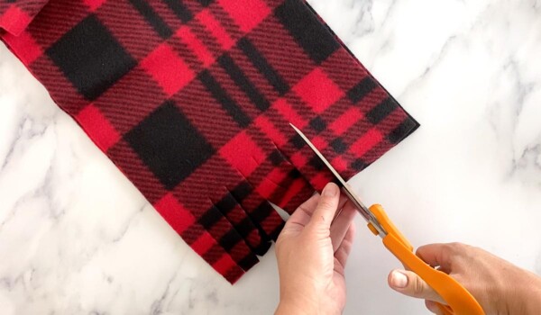 Cut fringe in fleece scarf