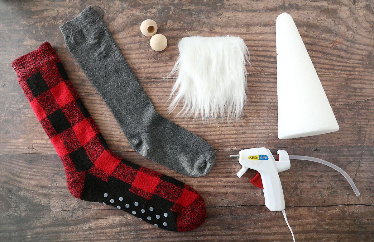 Sock gnome supplies: patterned sock, solid sock, wood bead, faux fur, foam cone, hot glue gun