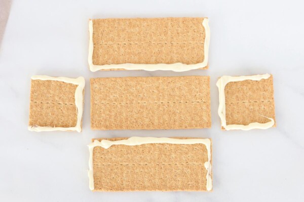 Graham crackers with melted white chocolate for "glue"