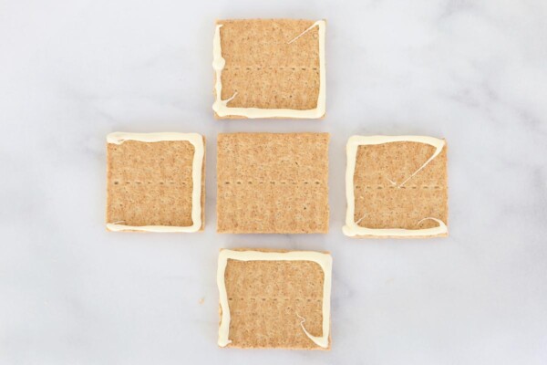 Graham crackers with melted white chocolate for "glue"