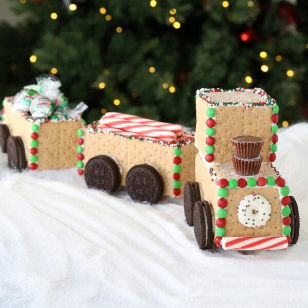 Candy train made from Graham crackers in front of a Christmas tree