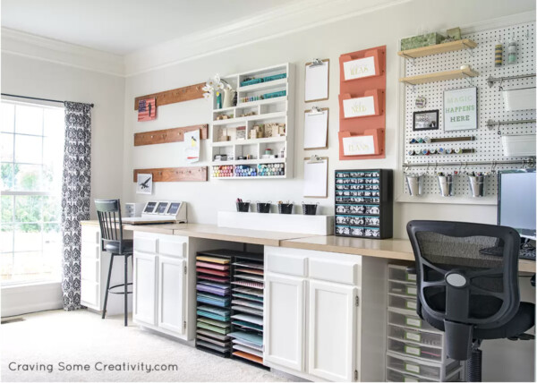 Large craft desk made with stock cabinets and plywood on top