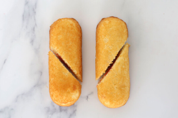 Two twinkies, cut diagonally from just below the curve on the outside to just above the curve on the inside
