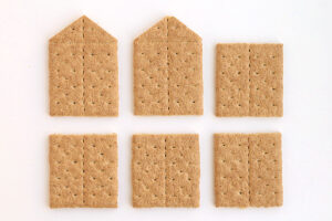 Graham cracker pieces needed to assemble house: four graham cracker halves and two graham cracker wall with roof support triangles