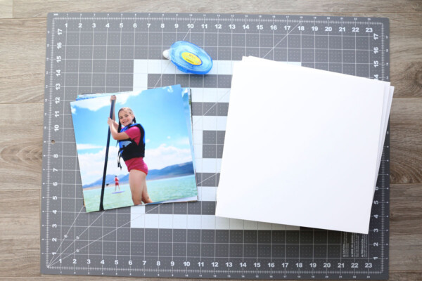 Photos, foam core squares, adhesive, and large cutting mat