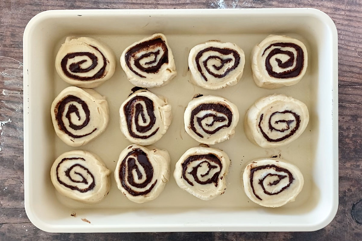 Twelve chocolate babka rolls in a 9x13 pan