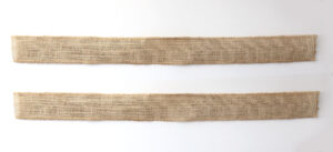 Two strips of burlap ribbon glued together with pipe cleaners in between them