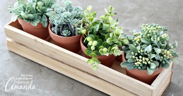 Wood shim planter box with potted plants inside