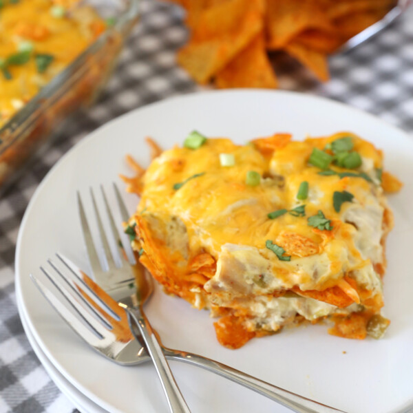 Piece of doritos casserole on a plate with two forks