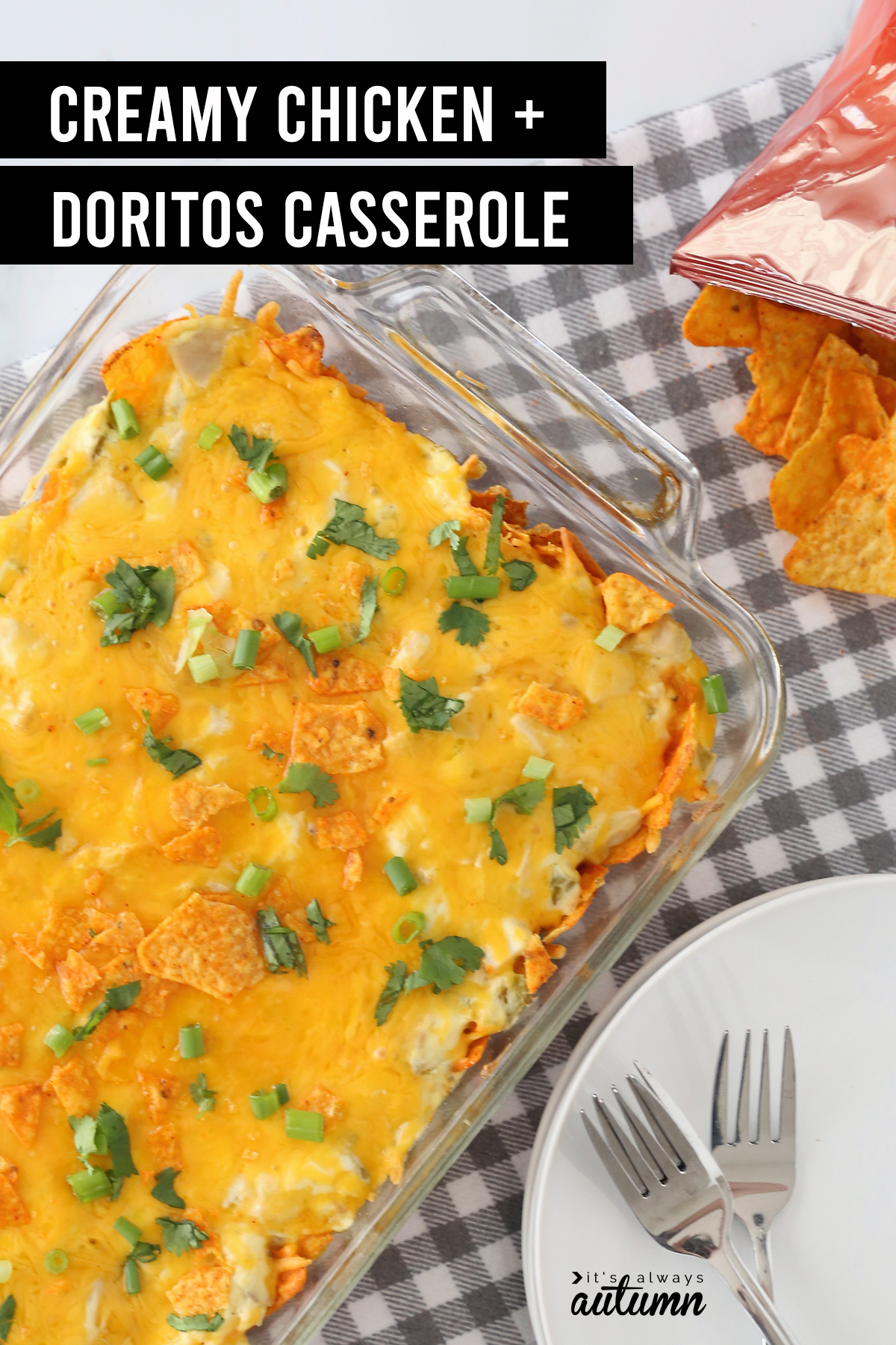 Creamy doritos enchilada casserole in a glass dish with a plate and forks