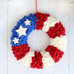 American flag loop yarn wreath hanging on a wall
