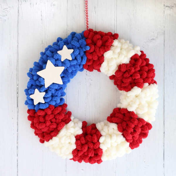 American flag loop yarn wreath hanging on a wall