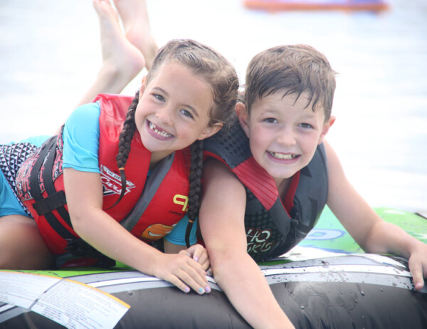 Boy and girl wearing life jackets