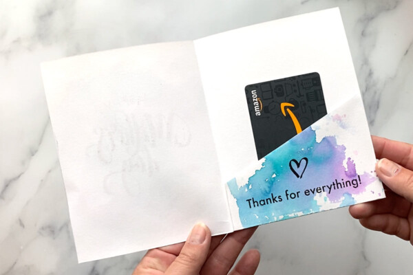 Flap has been folded up inside the card to create a pocket for a gift card