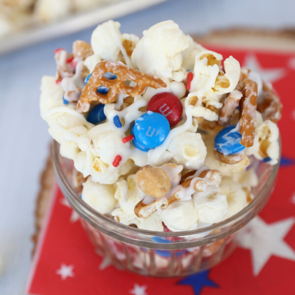 Bowl of patriotic popcorn mix with pretzels and M&Ms