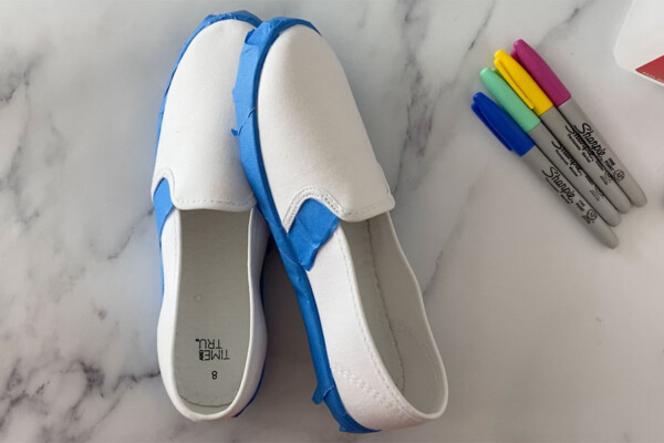 White canvas shoes with the soles taped off