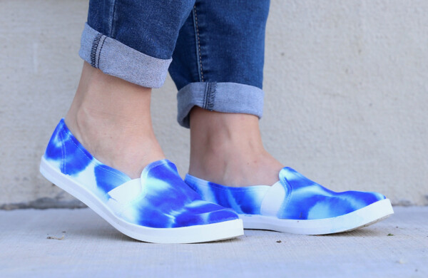 Feet wearing sharpie dyed shoes