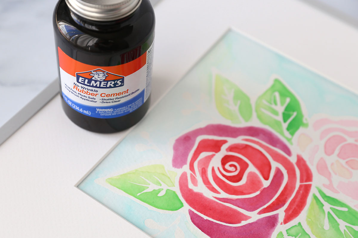 Flower painting and bottle of rubber cement