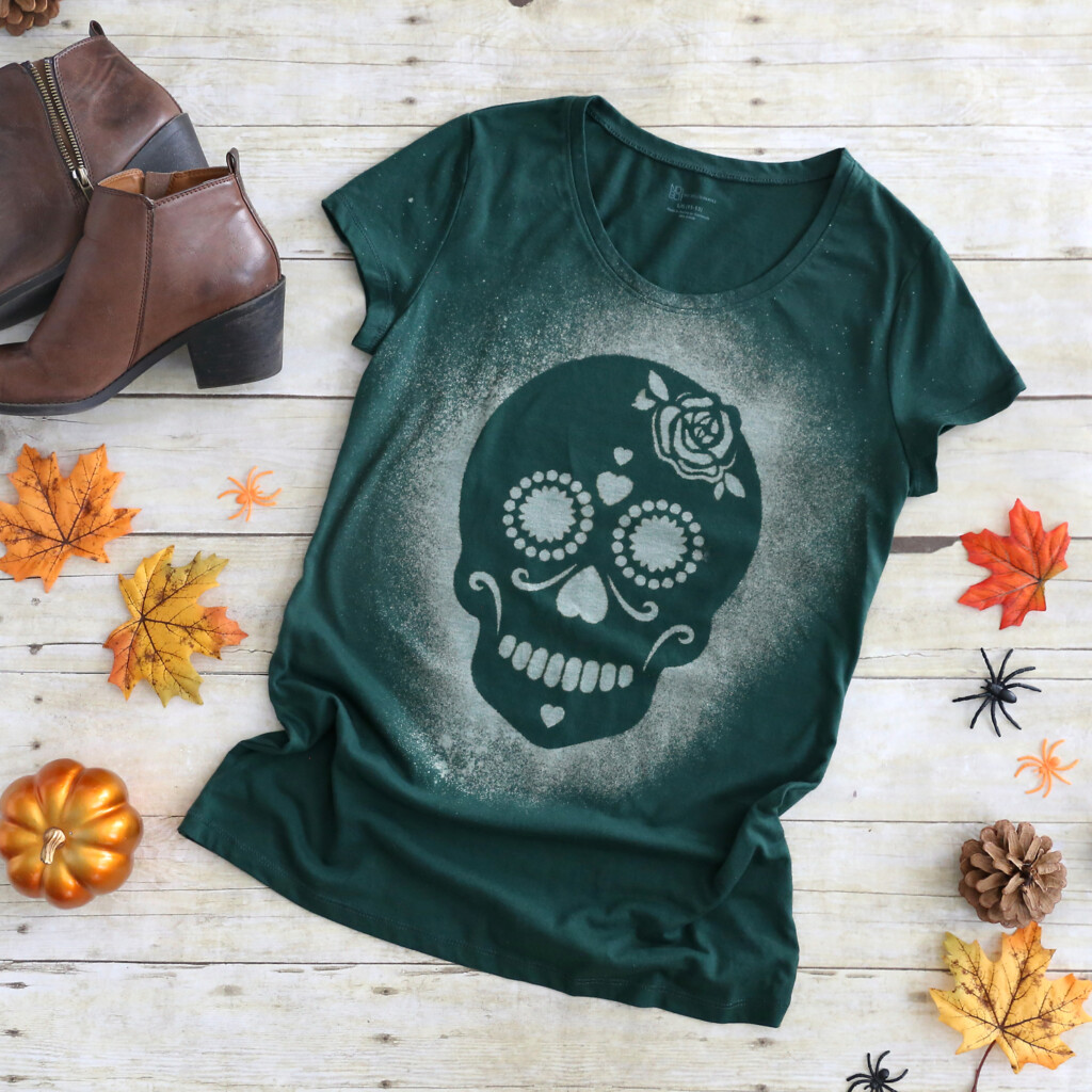 Green t-shirt with Halloween design dyed with bleach