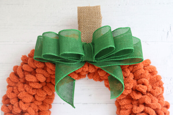 Green burlap ribbon tied into large bow
