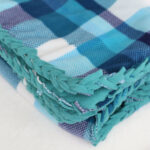 Folded fleece blanket with braided edge