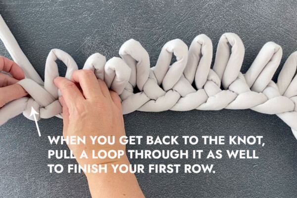 When you get back to the knot, pull a loop through it as well to finish your first row
