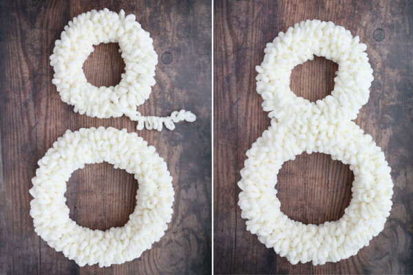 Two wreaths wrapped in white loop yarn, connected to form figure 8