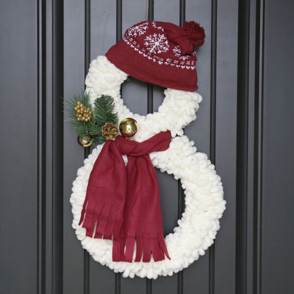 DIY snowman wreath hanging on a black door