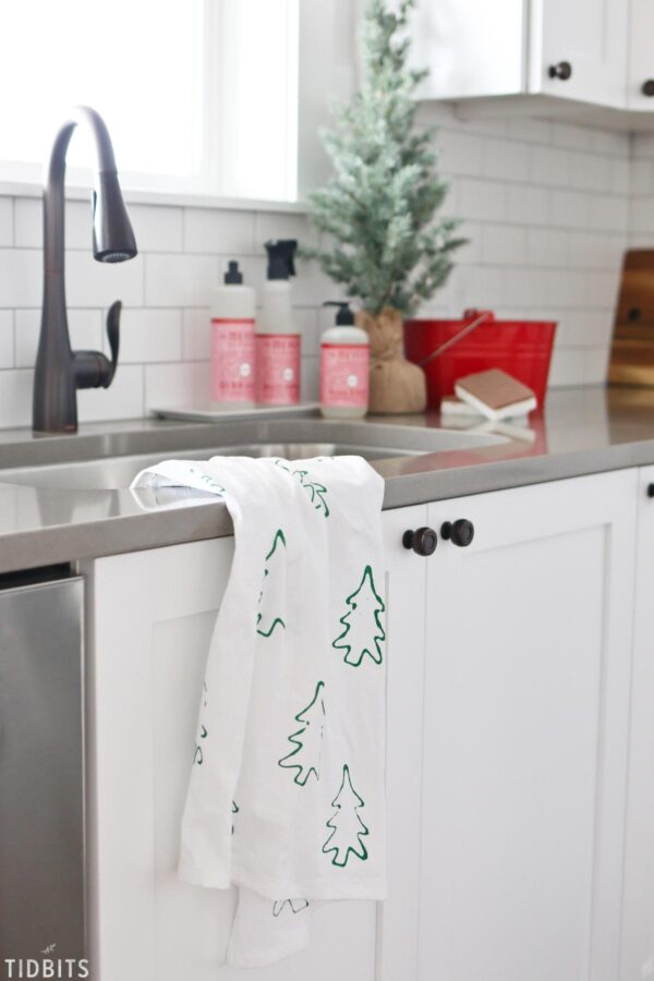 Tea towel with Christmas trees stamped on it.