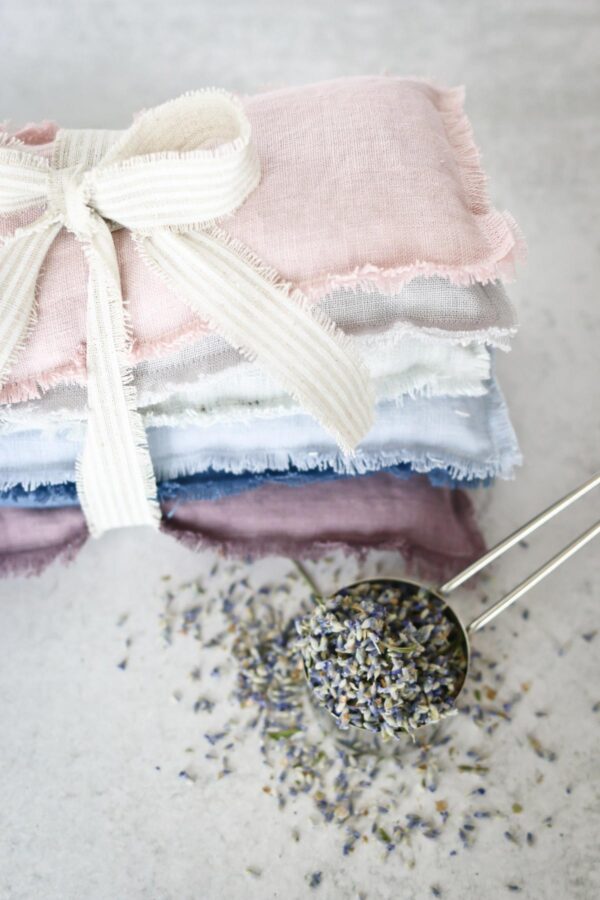Stack of lavender eye pillows tied with a bow.